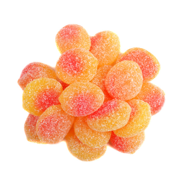 Bright orange Sour Patch Kids Peaches gummy candies, small, peach-shaped, with sour crystals, about 98 per pound.