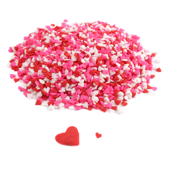 Assorted red, white, pink mini heart sprinkles. Small, cute heart-shaped candy for Valentine's desserts & baking.