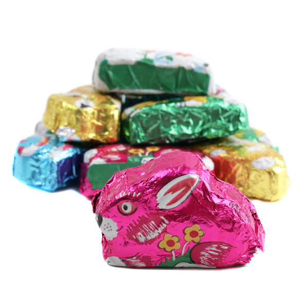 Sitting milk chocolate bunnies, approx 50 per lb, wrapped in brightly colored Italian foil, for Easter.
