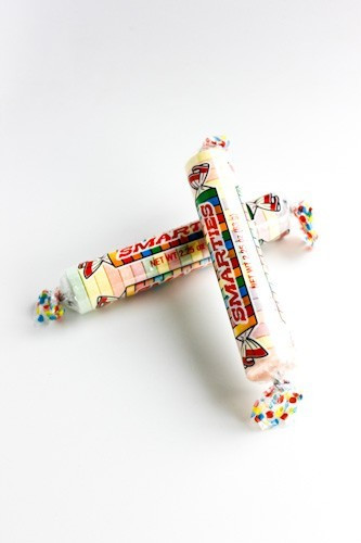 Mega Smarties, 12 boxes each with 24 rolls, classic pastel colors, 1-inch diameter candies.