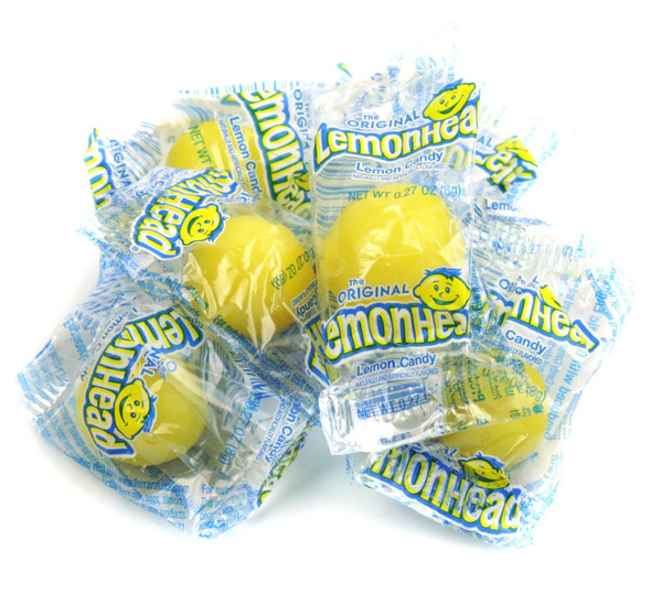 Lemonheads Candy, bulk 27lb box, vibrant yellow, individually wrapped, round, sour lemon hard candies.