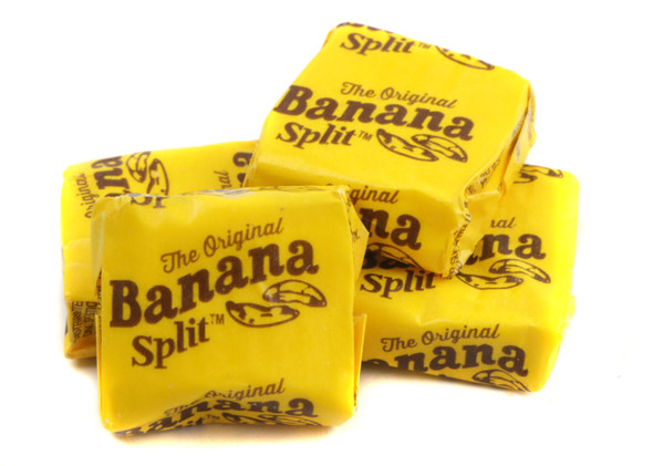 20LB case of yellow, square Banana Split Taffy pieces, chewy retro candy.