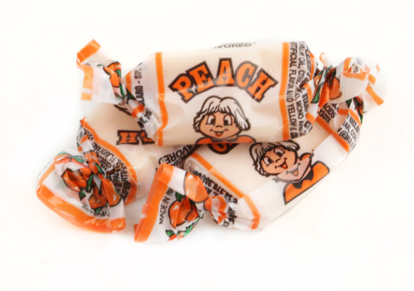 Bright orange Alberts Peach Fruit Chews, 240 individually wrapped chewy mini candies per bag, 18 bags total.