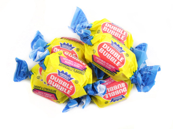 25 LB bulk case of Dubble Bubble Original Twist Bubble Gum. Yellow and blue wrapped, barrel-shaped bubblegum pieces.