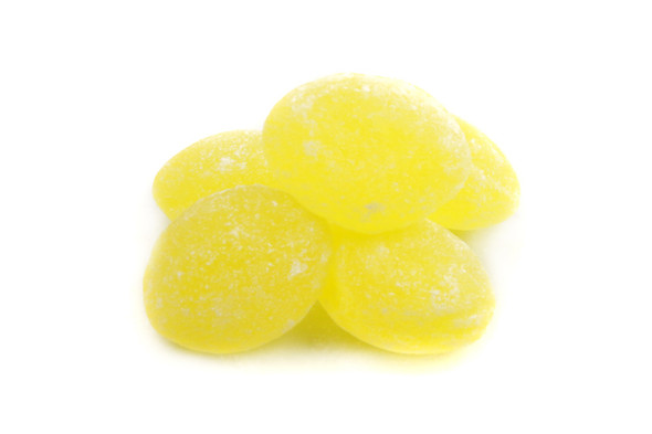 Bright yellow, sugar-sanded Claey's Lemon Drops hard candies. Sweet lemon flavor, 10lb bulk box.