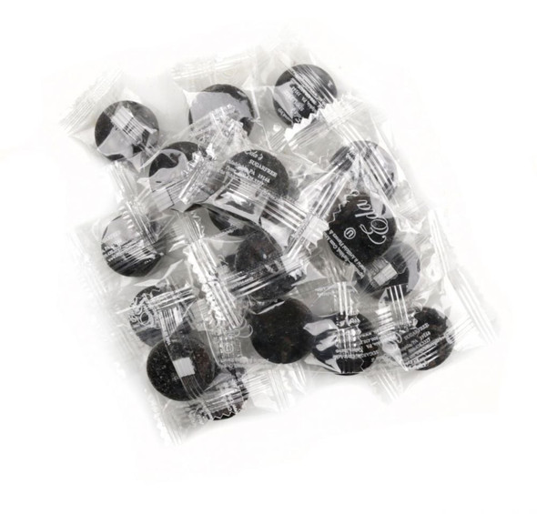 Eda's Black Licorice Sugar-Free hard candy. Large pile of dark black candies, 15 LB bulk case.