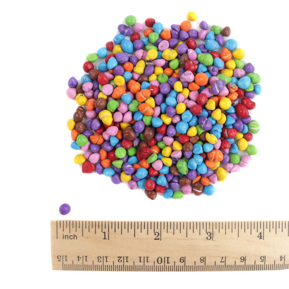 Vibrant rainbow candy-coated chocolate chips with multi-colored crisp shells, smooth chocolate centers. Delicious crunch, ideal for baking.