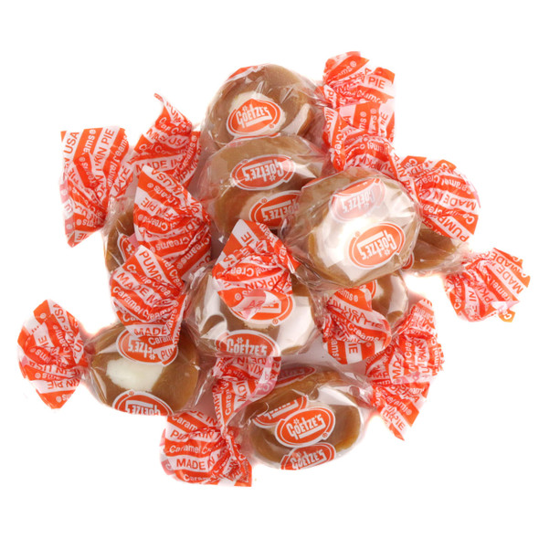A bulk arrangement of individually wrapped Goetze's Pumpkin Pie Caramel Creams in fall-themed wrappers