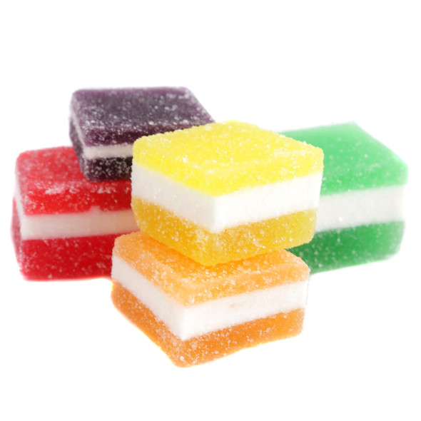 individual unwrapped green apple and strawberry lemon jelly fruit bites, highlighting their soft, tender texture and rich colors