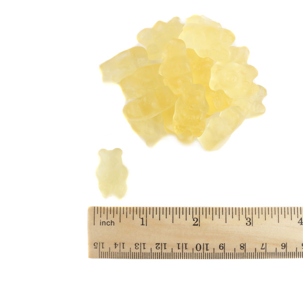 Pile of bright yellow pineapple gummy bears, approx 145 per pound, 1 inch long. Delicious tropical gummy candy.