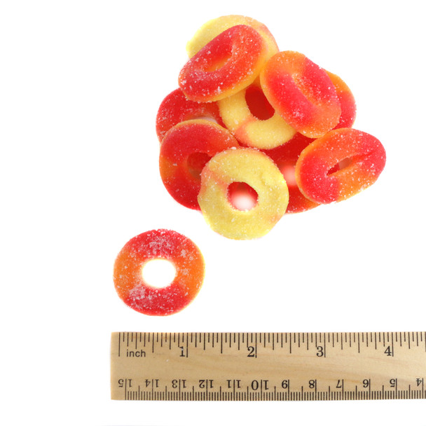 Trolli Peach Rings, approximately 64 per pound, chewy peach-flavored gummy rings dusted with white sanding sugar.