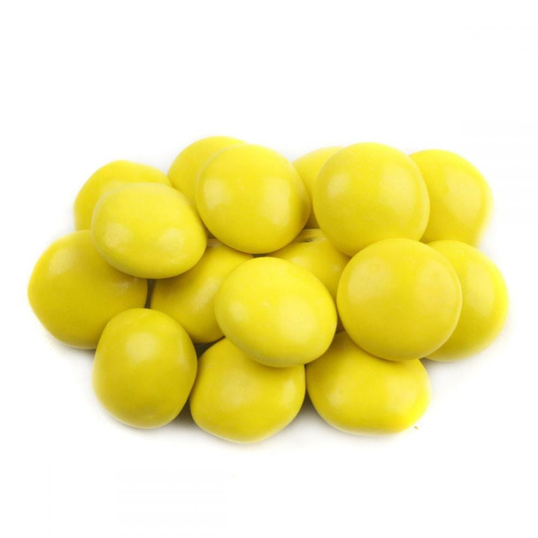 Pile of bright yellow Milk Chocolate Gems, crunchy candy shell, approx 400 pieces per pound.