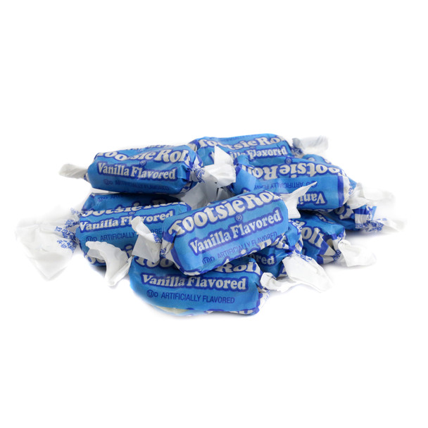 Limited Edition Vanilla Tootsie Rolls, creamy white, individually wrapped in vibrant blue wrappers, approximately 68 per pound.