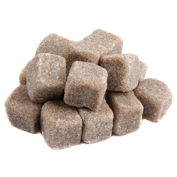 Many brown sugar coated Licorice Cubes, imported Holland Griotten with soft black licorice inside, bite-sized, sweet, savory.