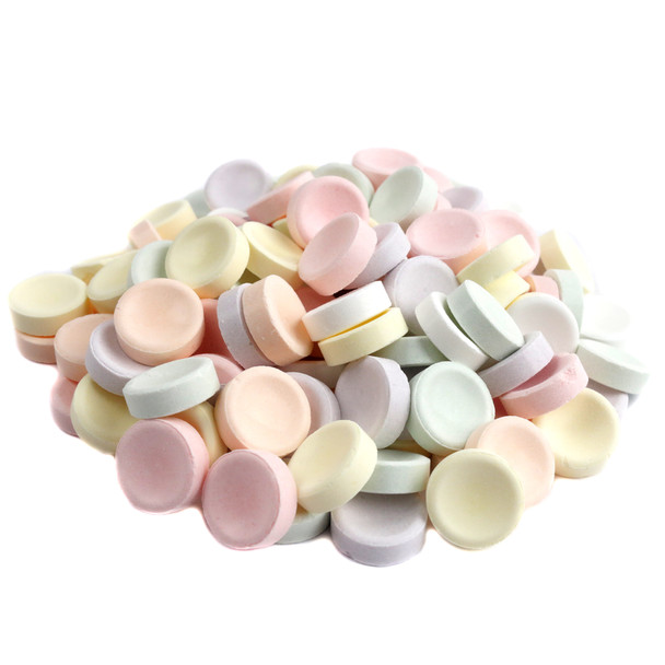 Bulk unwrapped Smarties, approximately 900 per pound, showcasing vibrant rainbow colors. Tart, sweet pressed candy.