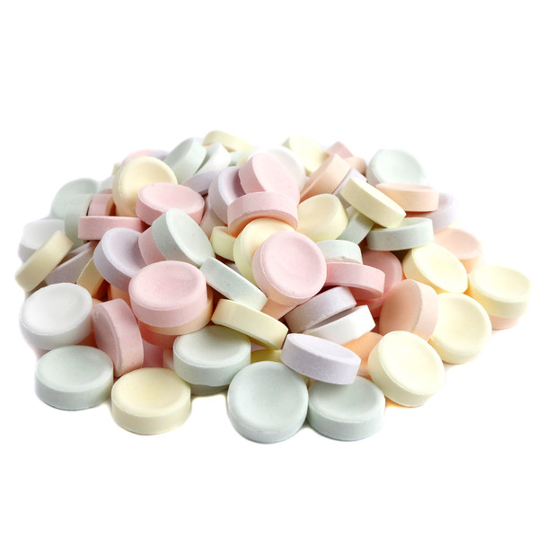 Piles of unwrapped Bulk Smarties candy, vibrant rainbow colors, approx 900 pieces per pound, ideal for candy buffets.