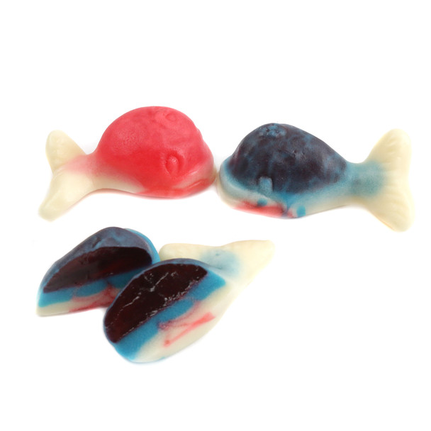 Small red and blue gummy whales with visible fruity centers. Approx. 50 pieces per pound.