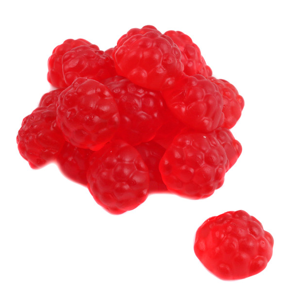 Many Albanese Gummy Red Raspberry candies, bright red, soft, plump, juicy, and raspberry-shaped.