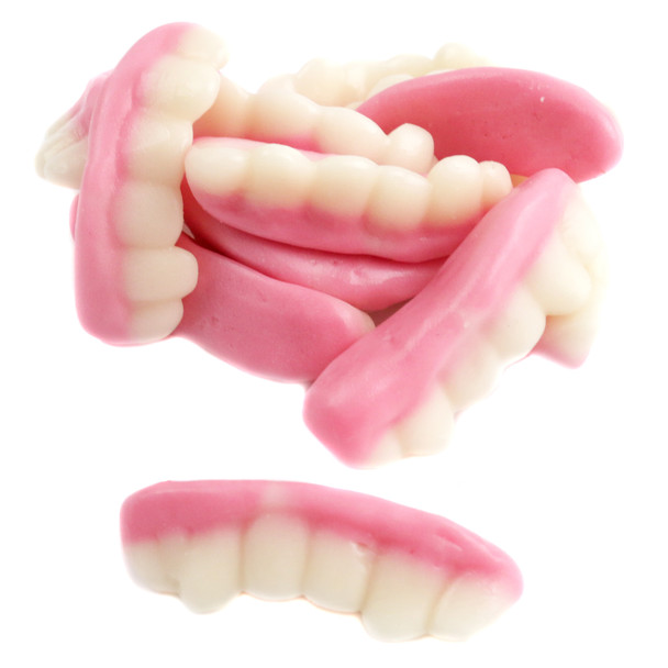Vibrant pink gummy teeth, chewy Halloween candy, approximately 35 pieces per pound, fruity flavor, fun gag gift.