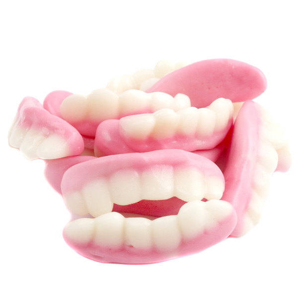 Vibrant pink Gummy Teeth candy, 3D whimsical design. Approximately 35 pieces per pound, perfect Halloween treat.