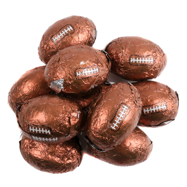 Chocolate Flavored Footballs, mini foil-wrapped candy with white laces. Approximately 90 per pound.