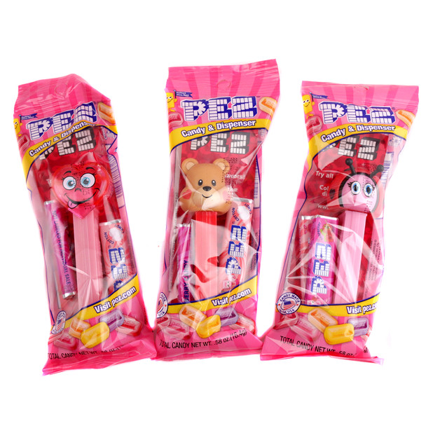 12 Pez Valentine dispensers, individually wrapped, red, pink, white heart-themed novelty candy, classic fun treat.