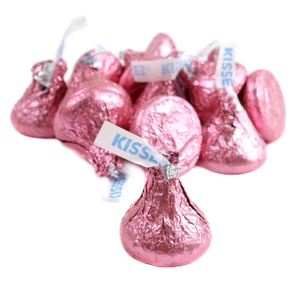 Individually wrapped light pink foil Hershey Kisses, approximately 100 per pound, perfect for baby showers.