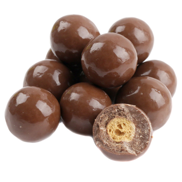 Bulk unwrapped, triple dipped milk chocolate malt balls, many round, rich brown, crunchy candies.