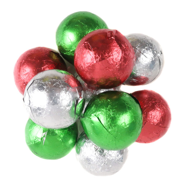 Milk chocolate balls wrapped in green, red, and silver foil for Christmas parties