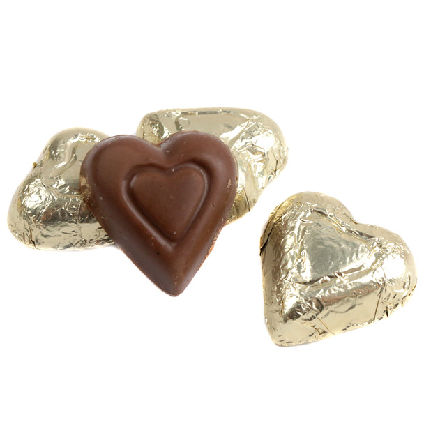 Gold foil wrapped Madelaine mini milk chocolate hearts, approximately 55 per pound. Milk chocolate, 1 3/8 inch hearts.