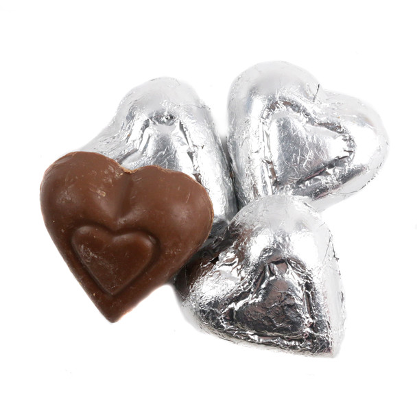 Silver mini milk chocolate hearts, shiny foil wrapped, approx. 55 per pound, elegant candy buffet addition.
