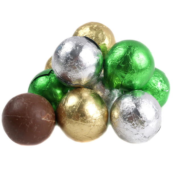 Milk chocolate balls wrapped in green, gold, and silver foil for St. Patrick's Day