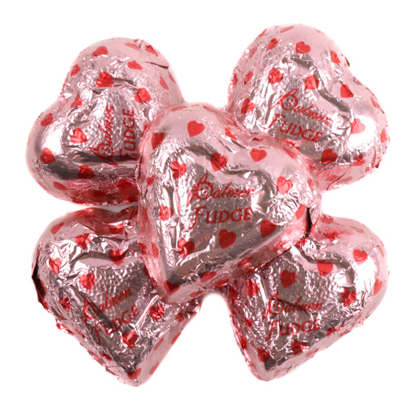 Pink, heart-shaped Palmer Chocolate Fudge Filled Hearts, foil wrapped with creamy fudge, approx 45 pieces per pound.