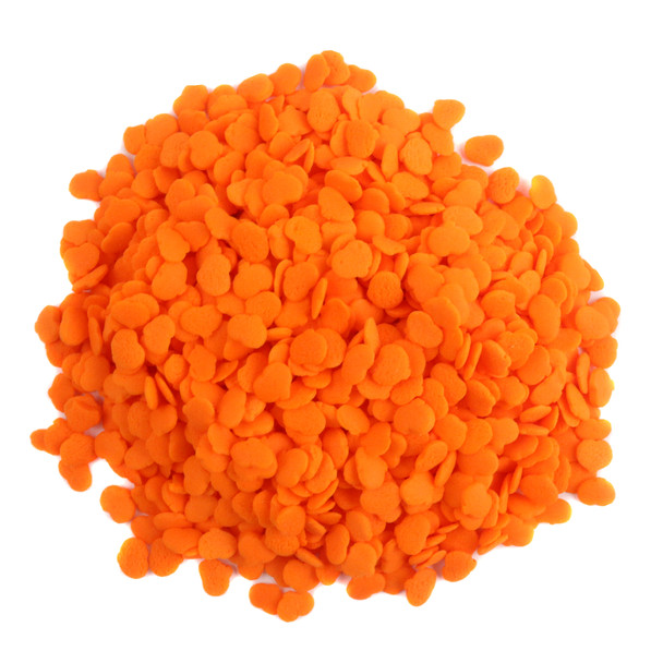 Vibrant bright orange pumpkin shaped sprinkles for Halloween baking, cake, and cookie decorating, festive dessert topping.
