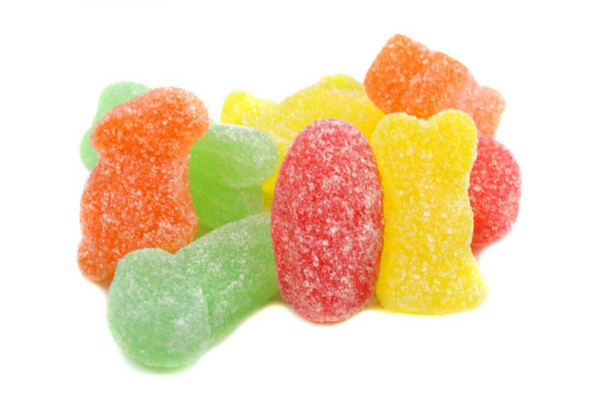 Assorted orange, cherry, lemon, lime jelly Easter eggs, bunnies, carrots candy mix, vibrant colors.