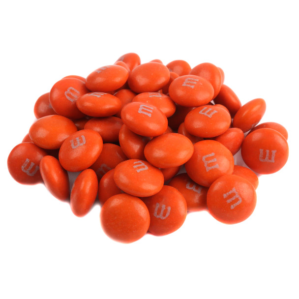 Pile of vibrant orange M&M's candies, approx. 500 per pound. Ideal for Halloween, fall, and party candy buffets.