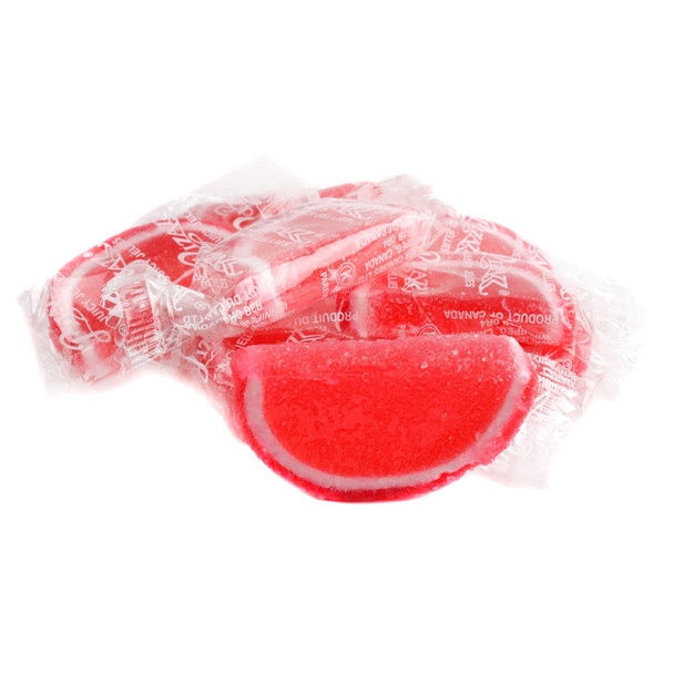 Strawberry Jelly Fruit Slices, red center with red and white edges, sugar-drenched, individually wrapped in clear cellophane.