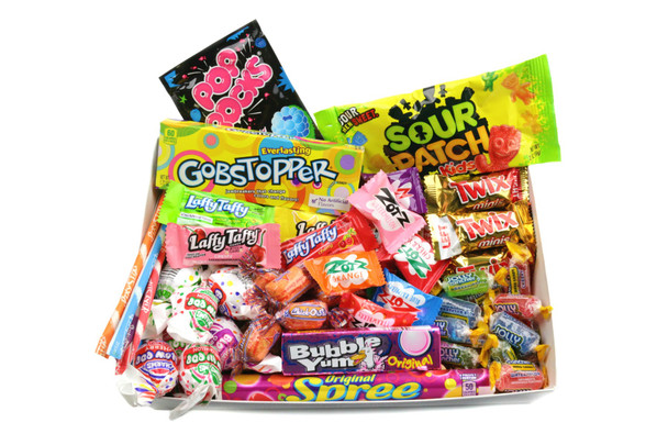 1970s retro candy box, over 50 pieces. Assorted colorful candies including Blowpops, Nerds, Pixy Stix, Laffy Taffy, Pop Rocks.