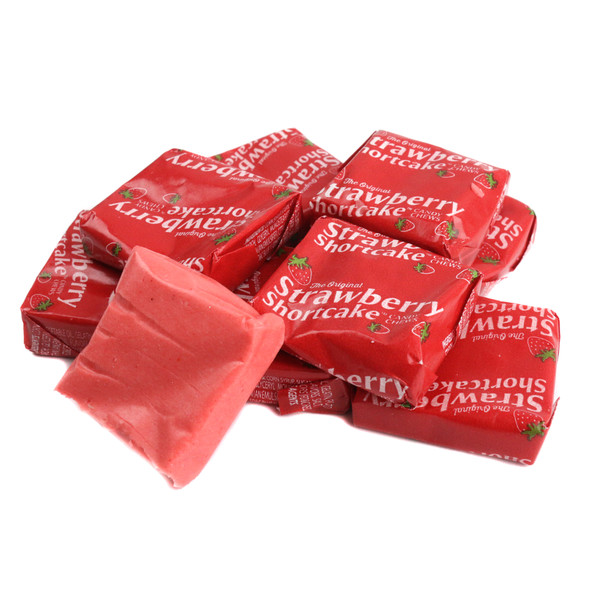Vibrant red Strawberry Shortcake Taffy, chewy square pieces, rich strawberry flavor, approx. 45 pieces per pound.