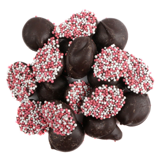 Reppert Valentine dark chocolate nonpareils, approx. 130 discs per pound, with red, pink, white sprinkles. USA made.