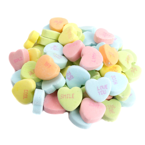 Sour colorful heart-shaped Conversation Hearts, individually printed with flirty phrases, perfect for Valentine's Day.