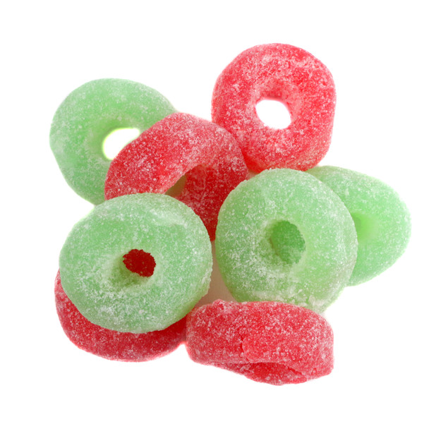 Red and Green Jelly Christmas Wreaths, sugar-coated cherry and lime flavored, festive candy for holidays.