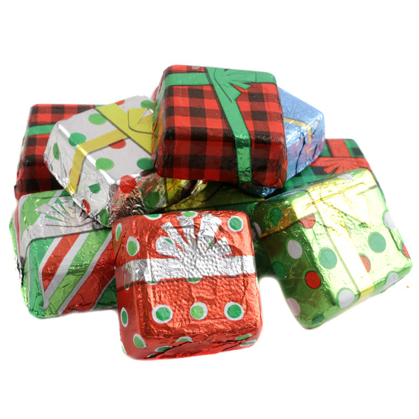 Smooth, creamy chocolate Christmas presents, individually wrapped in red, green, gold festive foil, 1-inch candies, approx. 48 per pound.