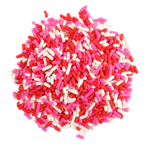 Close-up of vibrant red, pink, white Valentines Sprinkle Mix. Festive Jimmies for baking, cookies, and desserts.