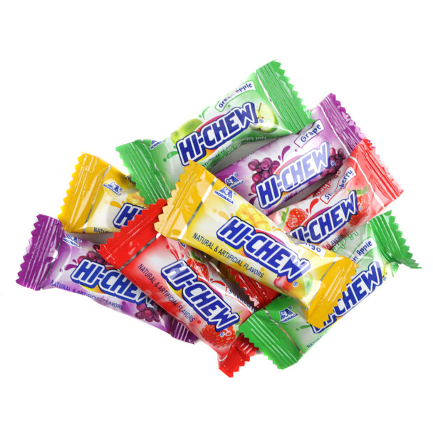 Hi-Chew candy featuring a pile of individually wrapped fruit chews in strawberry, green apple, mango, and grape flavors