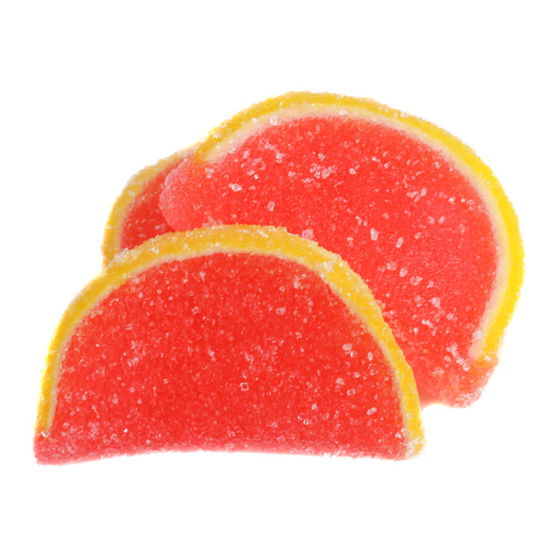 5LB box of soft, unwrapped Pink Grapefruit Jelly Candy Slices with pink centers, yellow rinds, sugar coated.