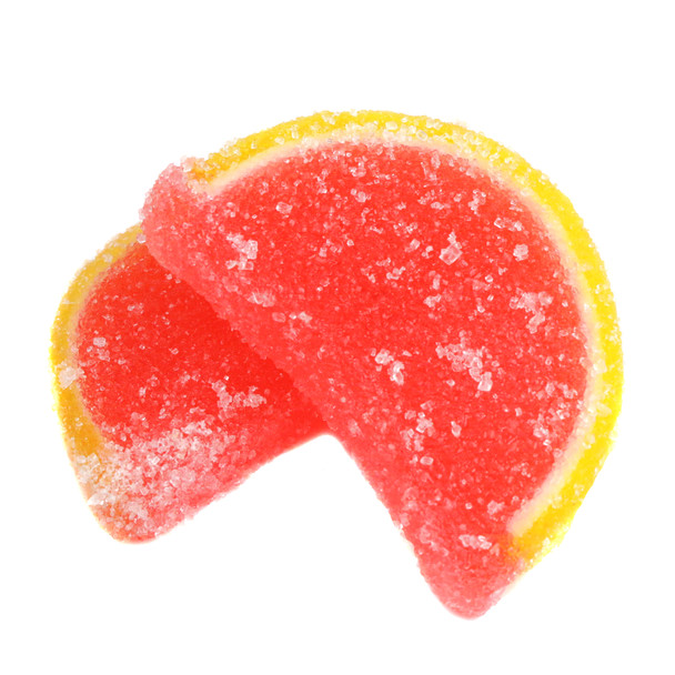 Pink grapefruit jelly candy slices, soft, sugar-coated, pink centers, yellow rinds. Unwrapped 5lb box.