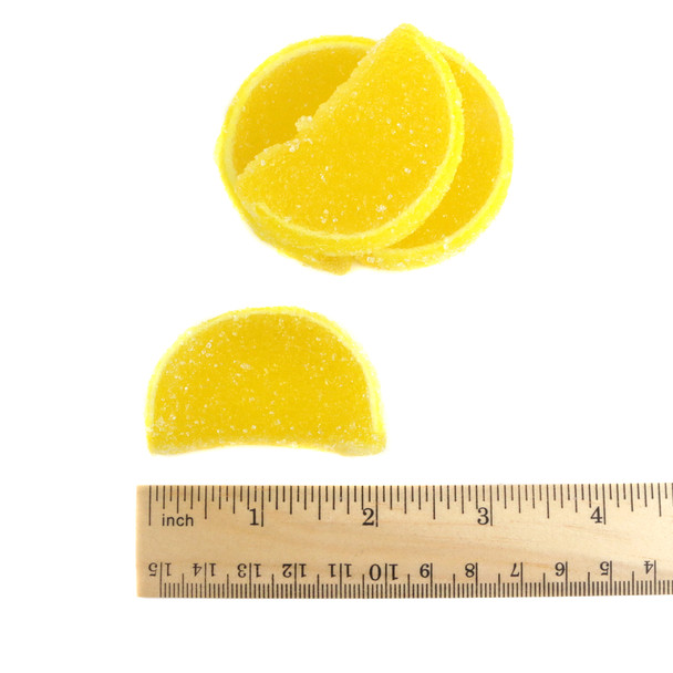 5LB box of unwrapped yellow lemon fruit slices, sugar-coated jelly candy resembling real lemons. Sweet, tangy.