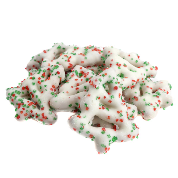 Christmas tree-shaped pretzels, white yogurt coating, festive red and green sugar sprinkles, delicious holiday treat.