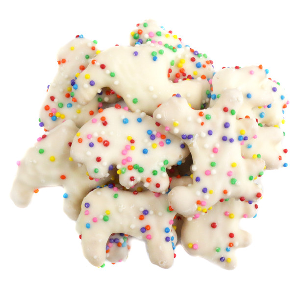 Festive yogurt covered animal crackers with thick white coating and bright colorful rainbow nonpareil sprinkles.